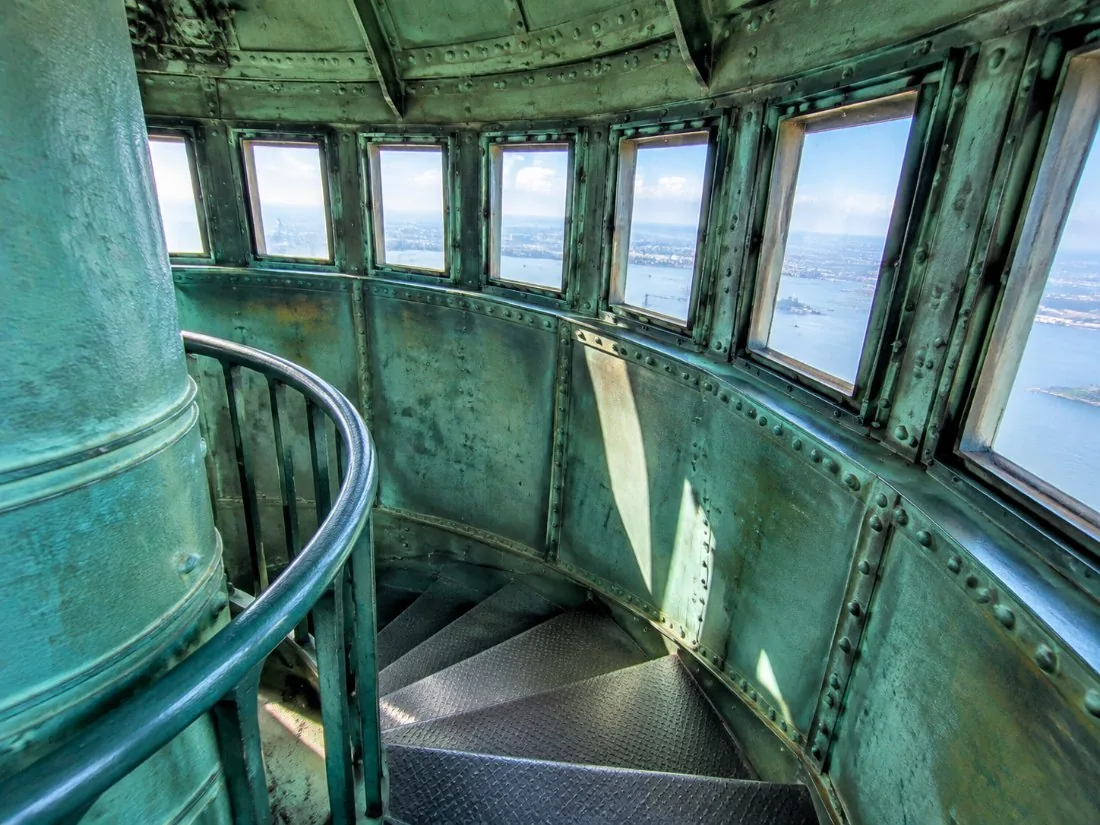 Inside the crown of the statue: a narrow spiral stair and a row of small windows letting in daylight